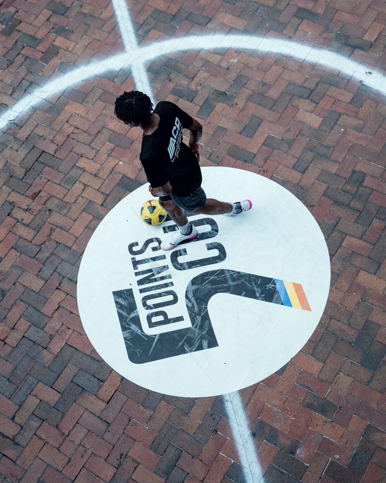Player on the ball over the 5 Points Cup center circle at Underground Atlanta